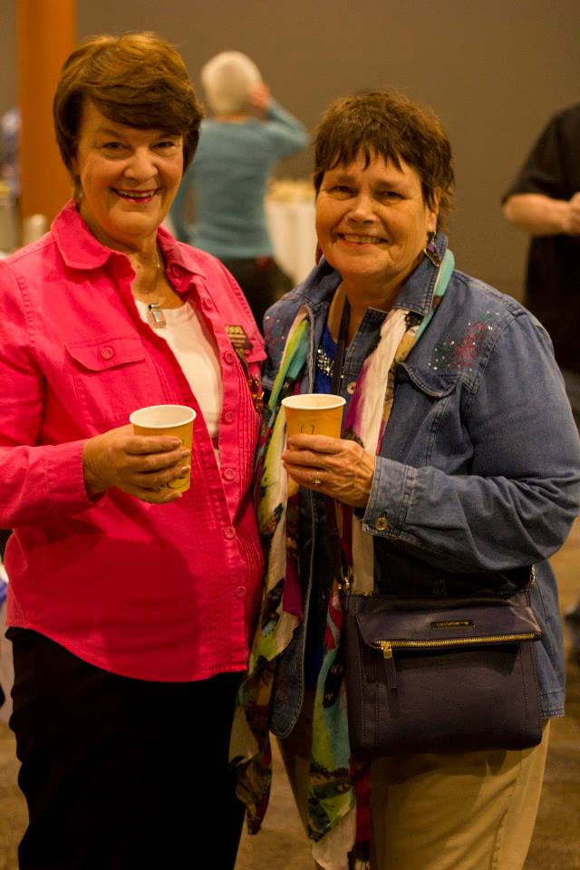 Happy visitors in a theater lobby DOWNTOWN GLENS FALLS THEATER