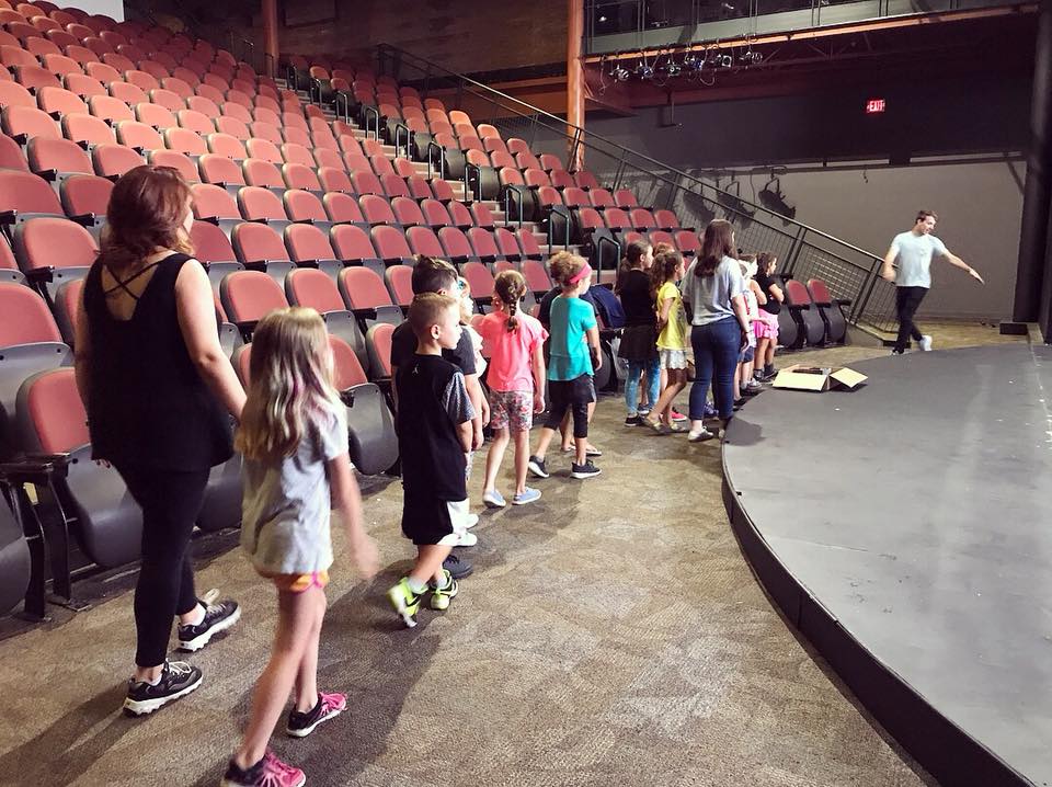 Children on a tour of a theater DOWNTOWN GLENS FALLS THEATER